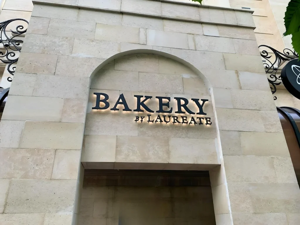 Custom LED logo sign for bakery installed in one of DFW plaza locations